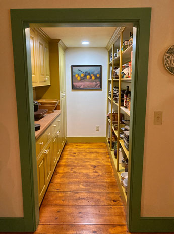 Pantry and wide plank flooring off the kitchen at the Wickford House